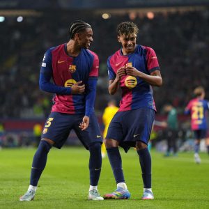BARCELONA, SPAIN - APRIL 09: Lamine Yamal (R) of FC Barcelona celebrates scoring his team's fourth goal with teammate Alejandro Balde (L) during the UEFA Champions League 2024/25 Quarter Final First Leg match between FC Barcelona and Borussia Dortmund at Estadi Olimpic Lluis Companys on April 09, 2025 in Barcelona, Spain. (Photo by Pedro Salado/Getty Images)